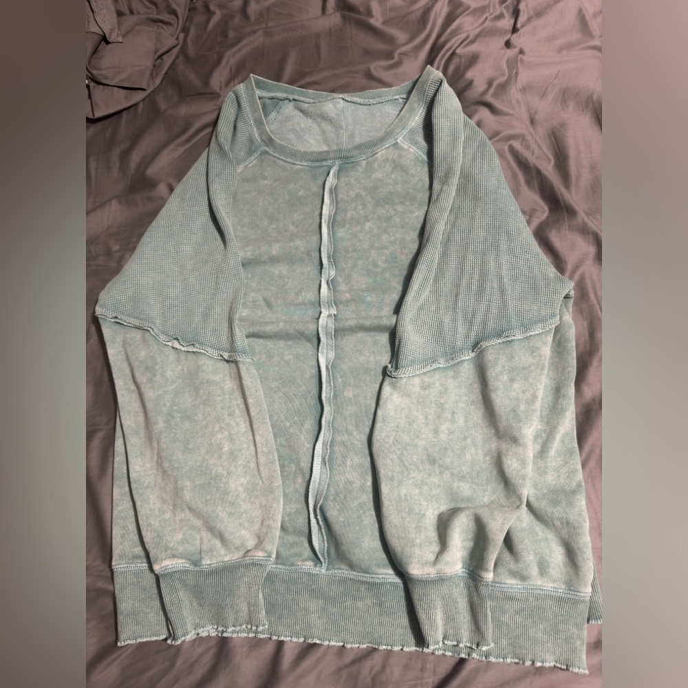 Exposed green pullover